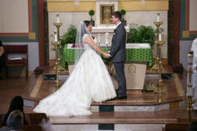 Load image into Gallery viewer, Justin Alexander &#39;Ivory Lace&#39; size 16 used wedding dress side view on bride with groom
