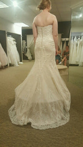 Custom Boutique 'Private Collection' size 8 new wedding dress back view on bride