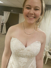 Load image into Gallery viewer, Custom Boutique &#39;Private Collection&#39; size 8 new wedding dress front view close up on bride
