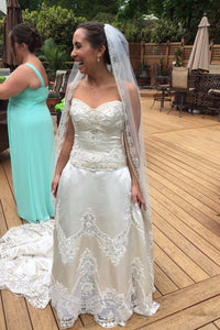 Amalia Carrara '104 cp-11' size 12 used wedding dress front view on bride