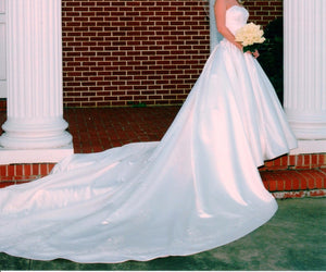 Audrey Hart 'Italian Satin' size 6 used wedding dress side view on bride
