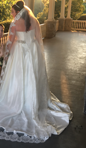 Aura Bridal '1057' size 14 used wedding dress side view on bride