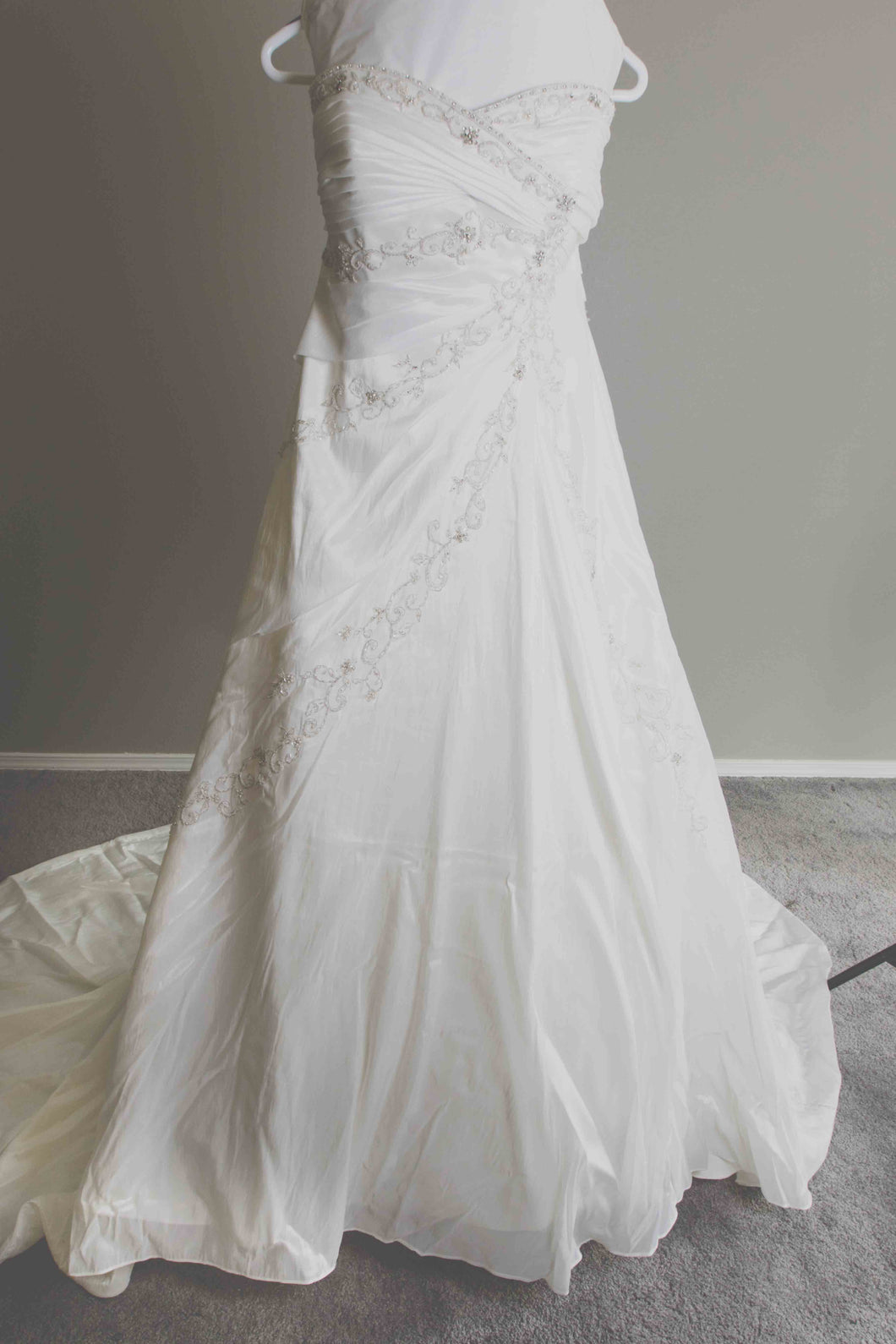 Custom 'Meagan Schlottmann'  size 16 used wedding dress front view on hanger