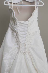 Custom 'Meagan Schlottmann'  size 16 used wedding dress back view close up  on hanger
