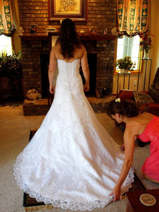 Maggie Sottero 'Straplesss' size 6 used wedding dress back view on bride