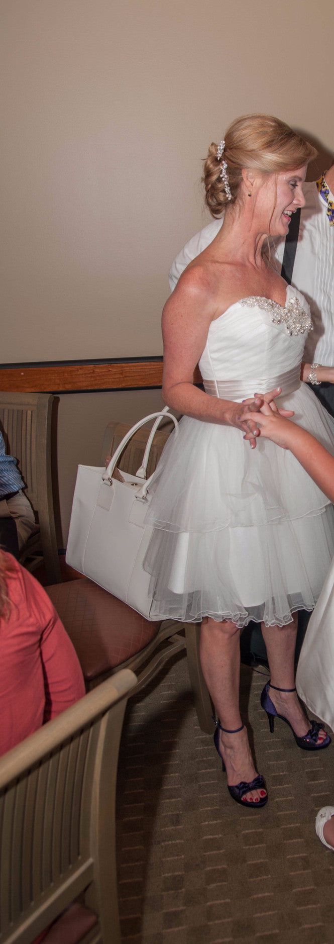 MTA Solano 'Ivory Elegance' size 4 used wedding dress front view on bride