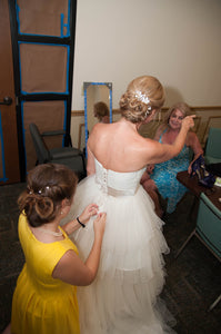 MTA Solano 'Ivory Elegance' size 4 used wedding dress back view on bride