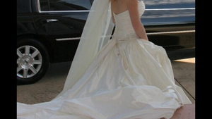Paloma Blanca ' CA05313' size 6 used wedding dress side view on bride