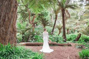 Amy Kuschel 'Halston' size 4 used wedding dress back view on bride