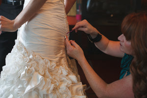 Martina Liana '296' size 0 used wedding dress back back view close up on bride