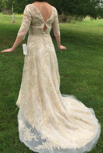 Oleg Cassini 'CWG630' size 6 new wedding dress back view on bride