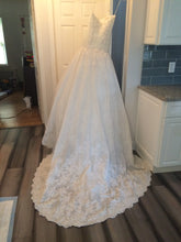 Load image into Gallery viewer, Mikael D &#39;Strapless&#39; size 6 sample wedding dress back view on hanger
