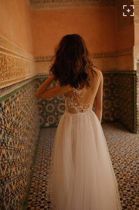 Liz Martinez 'Diana' size 6 used wedding dress back view on model