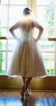 Load image into Gallery viewer, Oleg Cassini &#39;Long Sleeved Tea Length&#39; size 12 used wedding dress back view on bride
