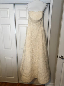 Vera Wang 'Ivory Strapless' size 12 used wedding dress front view on hanger