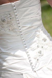 Blue 'Brigham' size 0 used wedding dress back view close up on bride