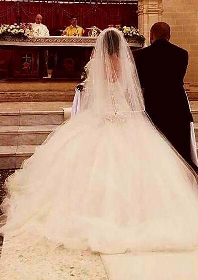 Custom 'Cinderella' size 8 used wedding dress back view on bride