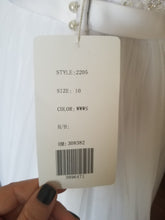 Load image into Gallery viewer, Casablanca &#39;2205&#39; size 8 new wedding dress view of tag
