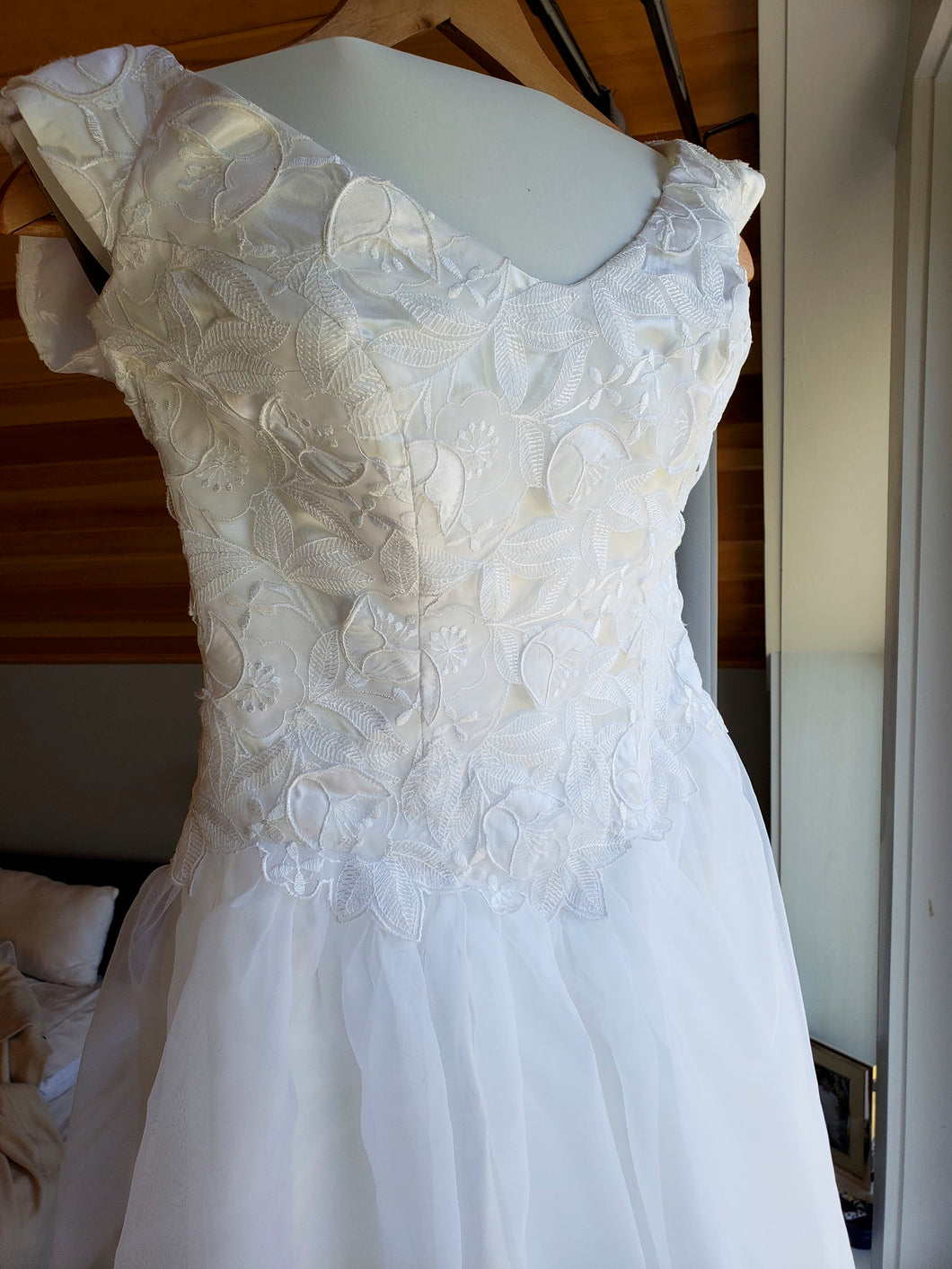 Custom 'Georgette of Boston' size 6 used wedding dress front view on hanger