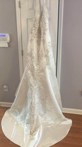 Custom '2001' size 12 new wedding dress back view on hanger