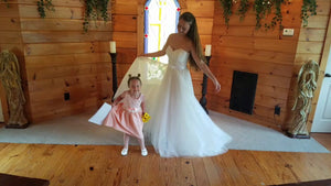 Custom 'Princess' size 8 used wedding dress front view on bride