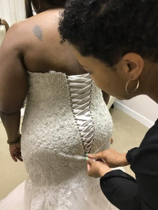 Allure Bridals 'Unforgettably Chic' size 24 used wedding dress back view on bride