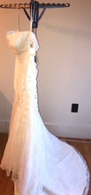 Load image into Gallery viewer, Oleg Cassini &#39;CWG377&#39; size 14 new wedding dress side view on hanger
