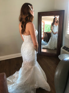 Rivini 'Bullock' size 6 used wedding dress back view on bride