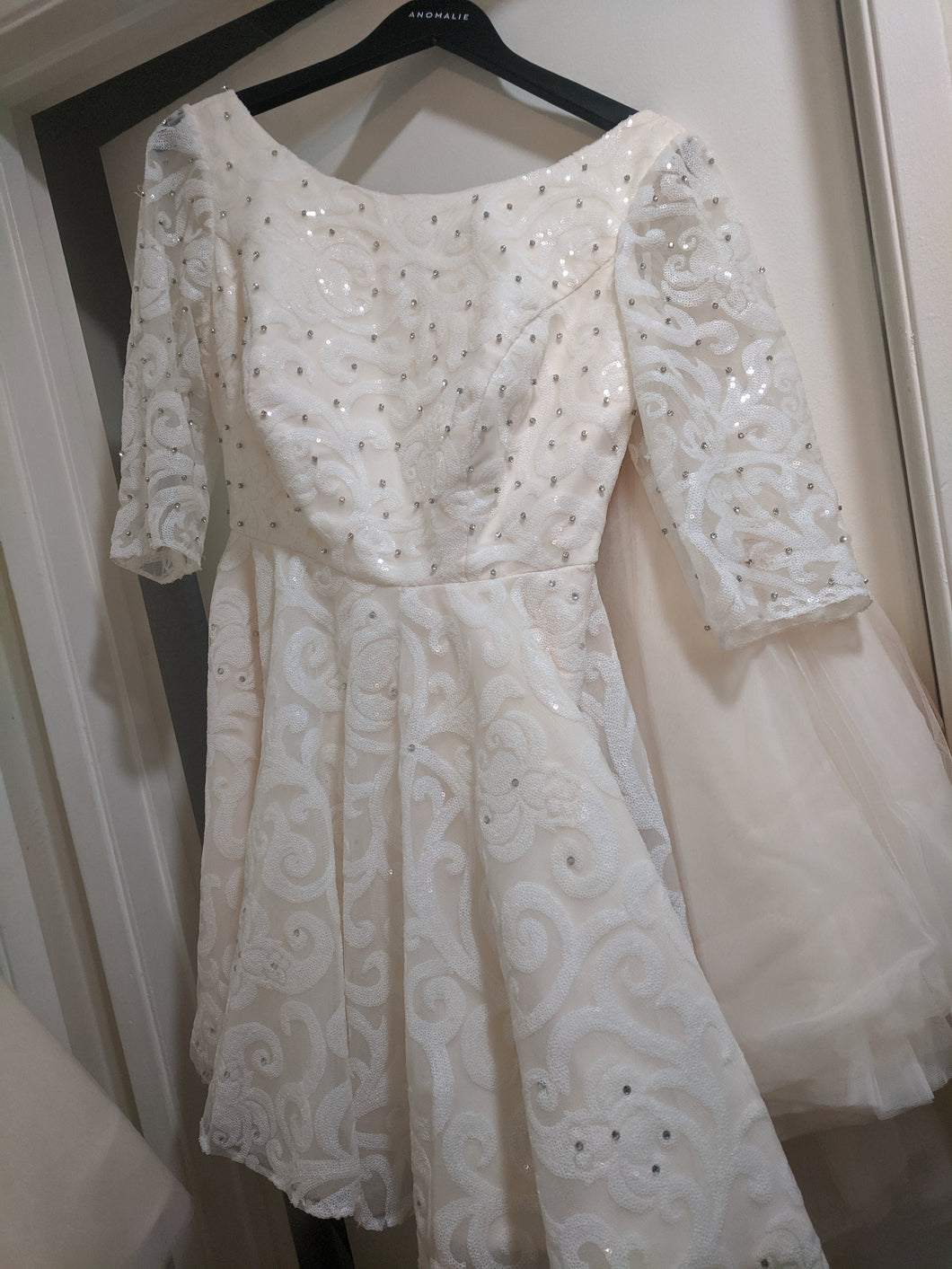 Custom 'Anomalie' size 10 used wedding dress front view on hanger