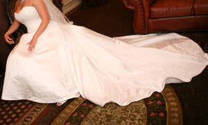 Demetrios 'RN 98249' size 10 used wedding dress side view on bride