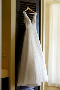 Angel Sanchez 'Unique Creation' size 4 used wedding dress front view on hanger