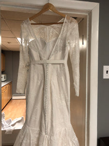 Zac Posen 'Lace' size 6 used wedding dress back view on hanger