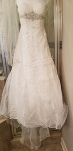 David's Bridal 'Ivory Strapless Organza' size 8 used wedding dress front view on hanger