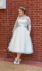 Oleg Cassini 'Long Sleeved Tea Length' size 12 used wedding dress front view on bride