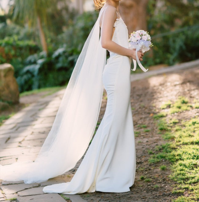 Custom 'Sheath' size 0 used wedding dress side view on bride
