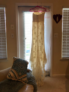 La Reve 'Princess' size 6 used wedding dress back view on hanger