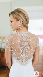 Rivini 'Avina' size 0 used wedding dress back view on model