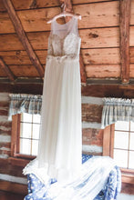 Load image into Gallery viewer, David&#39;s Bridal &#39;Lace and Crinkle Chiffon Sheath&#39; size 10 used wedding dress front view on hanger
