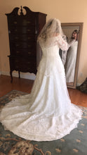 Load image into Gallery viewer, Oleg Cassini &#39;Off Shoulder Lace&#39; size 14 used wedding dress back view on bride
