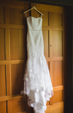 Load image into Gallery viewer, Enzoani &#39;Olva&#39; size 8 used wedding dress front view on hanger
