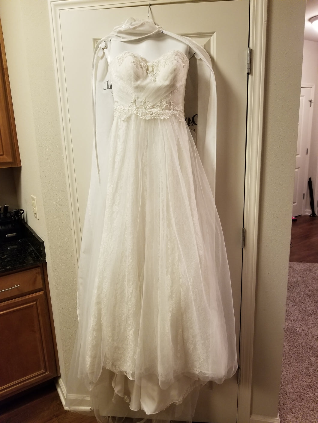 David's Bridal 'Strapless Tulle' size 2 new wedding dress front view on hanger