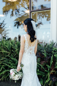 Custom 'Floral Mermaid' size 2 used wedding dress back view on bride