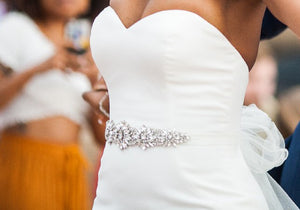 Custom 'Ivory Dress' size 8 used wedding dress side view on bride