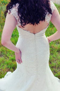 Lillian West 'Tulle Fit And Flare' size 8 used wedding dress back view close up on bride