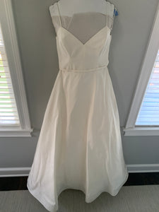Amsale 'Rowan Silk Faille' size 10 used wedding dress front view on hanger