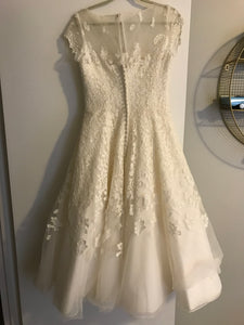 Oleg Cassini 'Illusion' size 6 used wedding dress back view on hanger