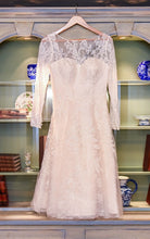Load image into Gallery viewer, Oleg Cassini &#39;Long Sleeved Tea Length&#39; size 12 used wedding dress front view on hanger
