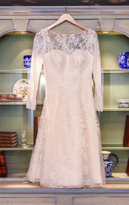 Oleg Cassini 'Long Sleeved Tea Length' size 12 used wedding dress front view on hanger