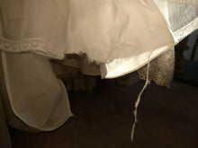 Load image into Gallery viewer, Allure Bridals &#39;2712&#39; size 6 used wedding dress view of hemline rip
