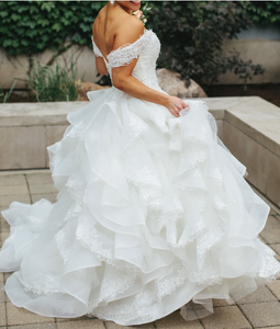 Madeline Gardner 'MCMG5110' size 6 used wedding dress side view on bride